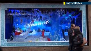 New York stores unveil Christmas 2013 windows NYC retailers get creative with holiday display [upl. by Becht]