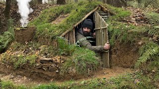 Building complete and warm survival shelter  Bushcraft earth hut grass roof amp fireplace with clay [upl. by Larrabee]