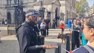 Armed police officer shuts down another Palestinian protester no flags no signs over there not here [upl. by Ponzo]