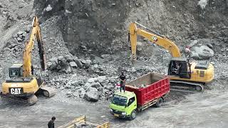 Large stones are collected and split by the caterpillar excavator [upl. by Oiramed698]