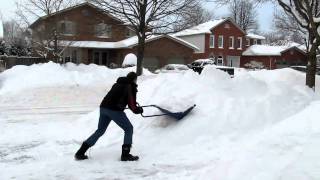 Mr John Hush shovels snow with a large scoop [upl. by Asaert]