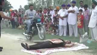 Asha Rani having 40 motorbikes running over her stomach in one minute [upl. by Ailev]