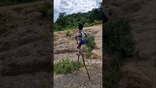 Boy from Banna tribe walking on stilts Omo Valley Ethiopia OmoValley [upl. by Errehs]