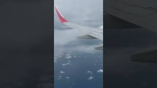 Flying above the Laccadive Sea ocean clouds flight flying Sea [upl. by Aihsotan]