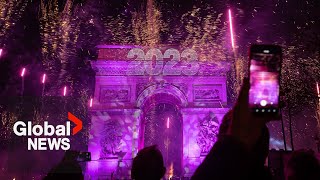 New Years 2023 Paris France gets the party started with fireworks smoke show over Arc de Triomphe [upl. by Lateehs]