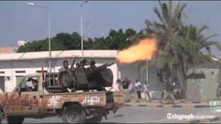 Libya conflict rebels fight their way into Col Gaddafis compound [upl. by Amby]