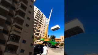 Crane Lifts Container House to New Heights [upl. by Eekorehc]