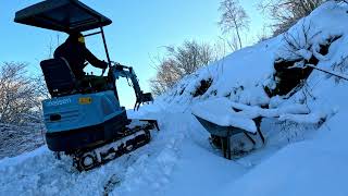 Moving snow on trails with the mini excavator blade [upl. by Alyson]