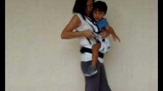 Manduca Baby Carrier Instructions  Switching from Side Carry to Front Carry Position [upl. by Ern803]