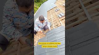 The process of installing roof tiles using a wooden frame [upl. by Lladnew97]