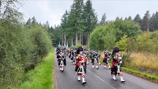 Return march of Lonach Highlanders through Cairngorms Park during 2024 Lonach Gathering in Scotland [upl. by Jsandye]