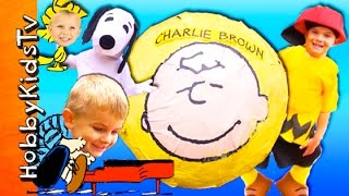 Giant CHARLIE BROWN Surprise SMASH EGG Adventure HobbyKids Visit a Lucy Booth [upl. by Asyral]