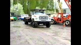 Sold Ford F800 Flatbed Ramp Truck Dovetail Equipment Backhoe bidadoocom [upl. by Oinegue]