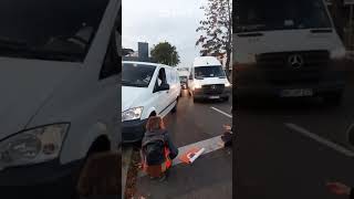 Van nearly hits ecoprotester as it mounts pavement to get past [upl. by Frederica]